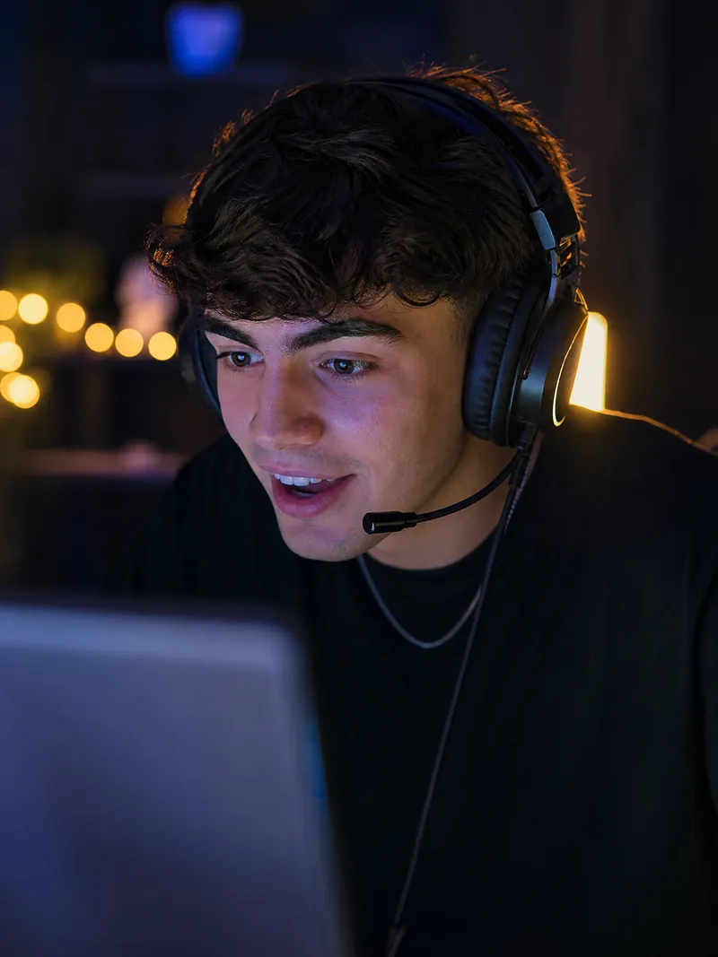 A gamer streaming LIVE with a headset